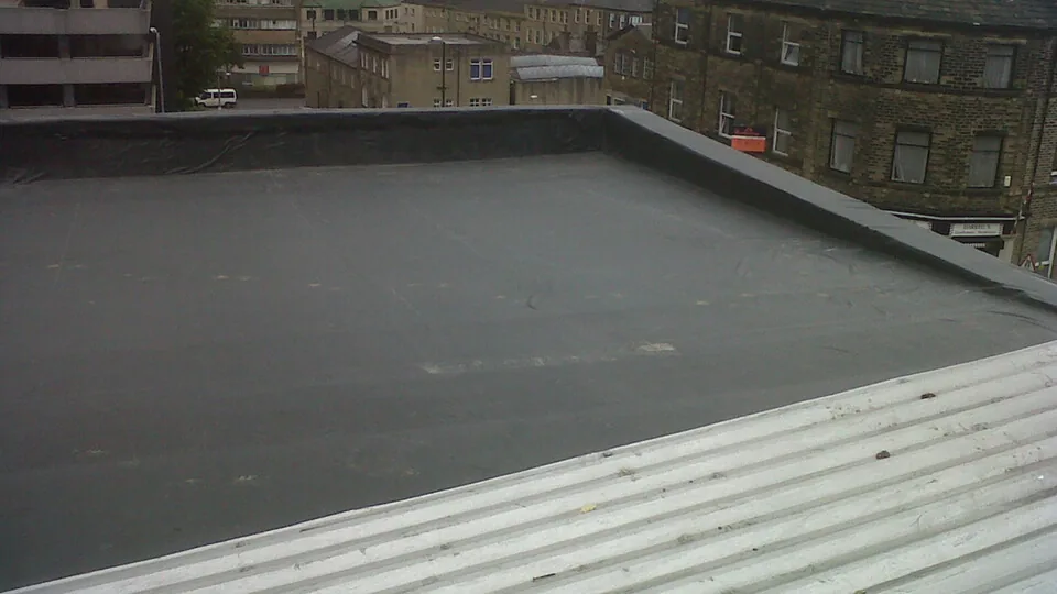 Aged EPDM rubber roof on a commercial building